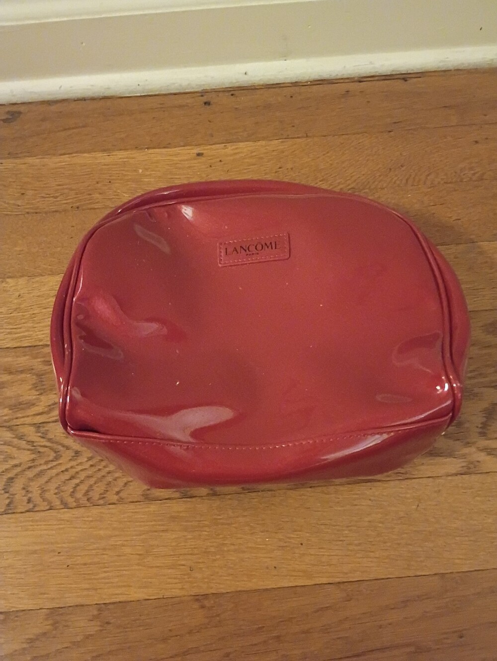 red zip up makeup/toiletries bag from lancome